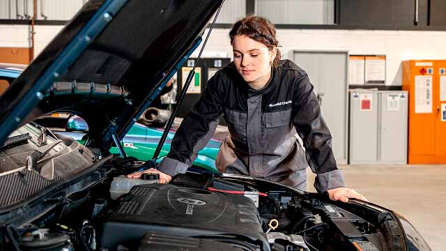 Citroën servicing, female mechanic working on car